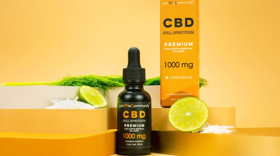 Premium CBD full spectrum serum with lime essential oil displayed on a vibrant yellow background. — Cannabis Near Me Making I